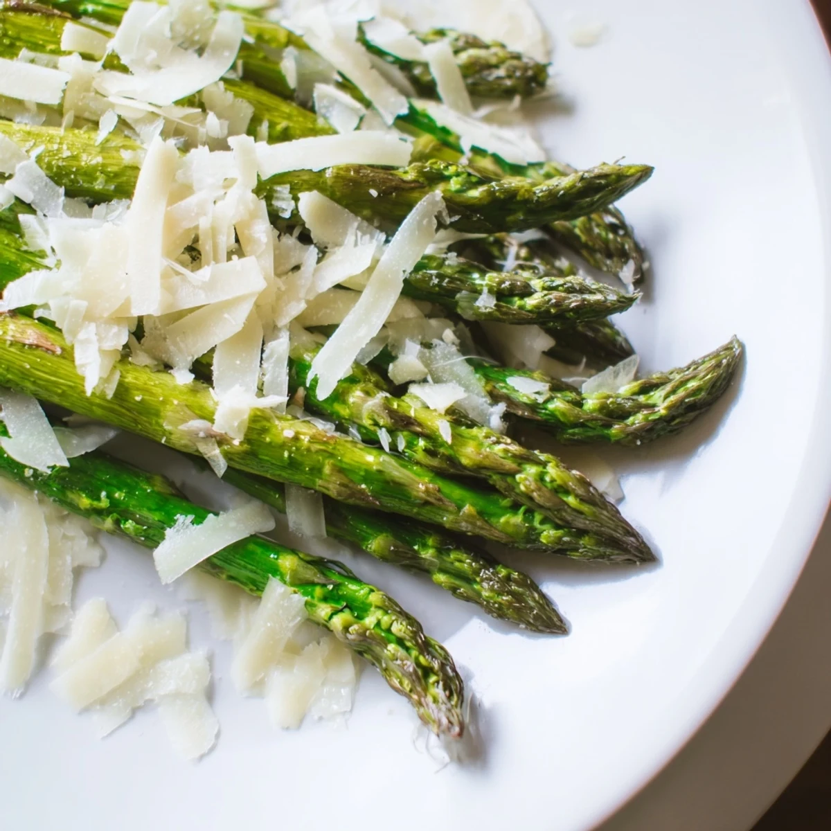 Glimpse the simple elegance: Perfectly roasted asparagus, topped with tangy lemon and Parmesan.