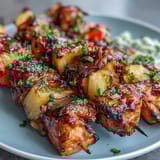 Vibrant Grilled Pineapple Chicken Skewers featuring smoky chicken, sweet pineapple, and colorful veggies on a skewer.  