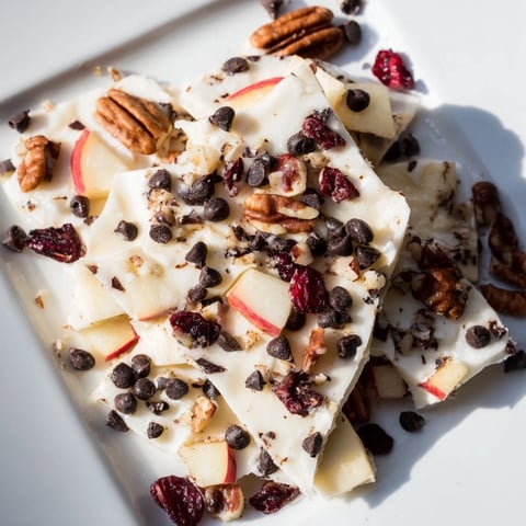 Creamy Apple Cinnamon Yogurt Bark topped with juicy apples and crunchy nuts looks delicious.