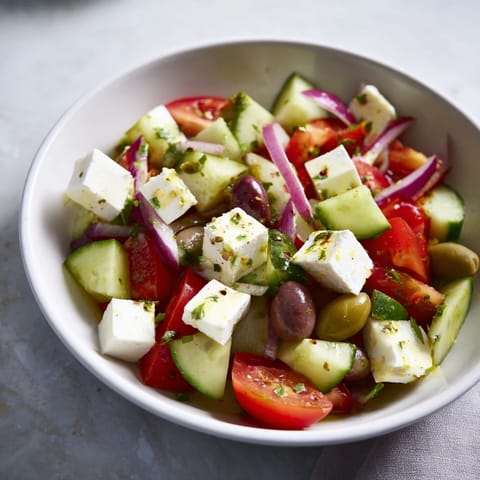This Fresh Mediterranean Salad with chickpeas and olives features vibrant veggies and salty olives, ready to eat.
