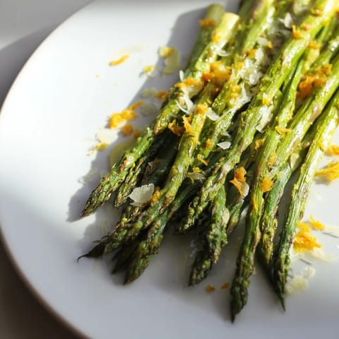 Vibrant photo of Roasted Asparagus with Lemon Zest and Parmesan, ready to serve warm.