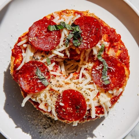 Golden, baked Mini Pepperoni Pizza Bagels with melted cheese, perfect for a quick and easy appetizer.