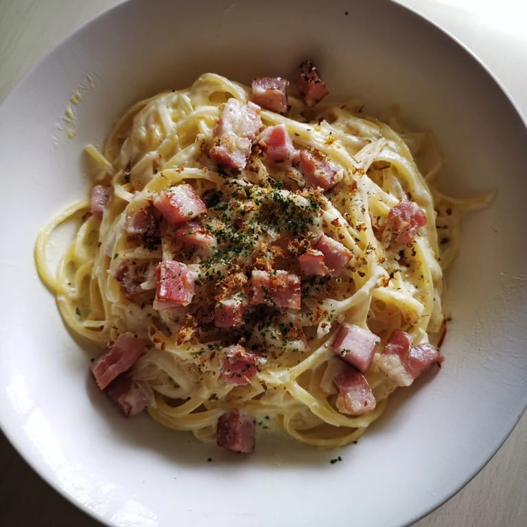 Enjoy a quick taste of The Best 15-Minute Creamy Carbonara: a beautiful Italian pasta dish, ready in minutes.