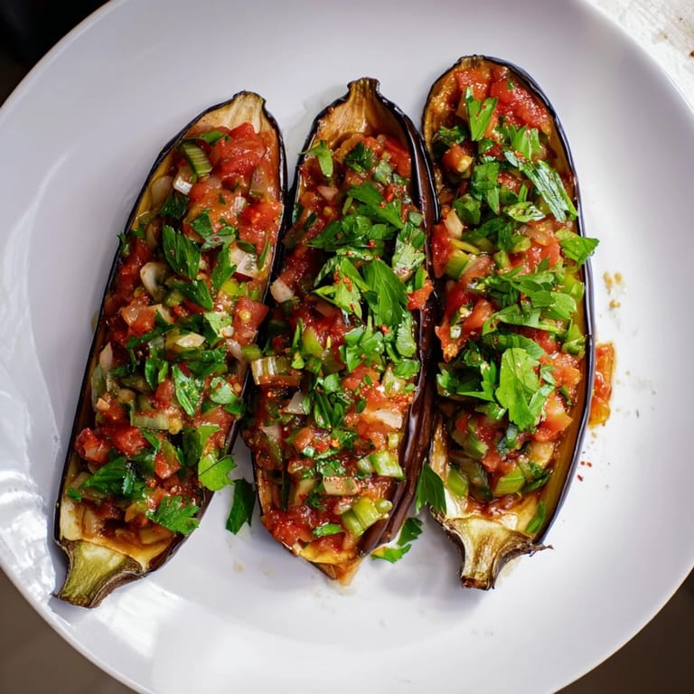 A close-up of steaming Imam Bayildi, showcasing a gorgeous vegetarian Turkish delight on a plate.